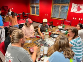 Students gather for a game night at the Tifton campus.  